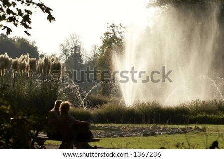 Elderly couple looking at the fountain
