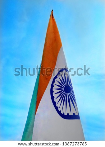 Indian flag waving against beautiful blue sky. Triangle made by flag of India. National Flag of India.