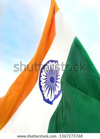 Indian flag waving against beautiful blue sky. Triangle made by flag of India. National Flag of India.