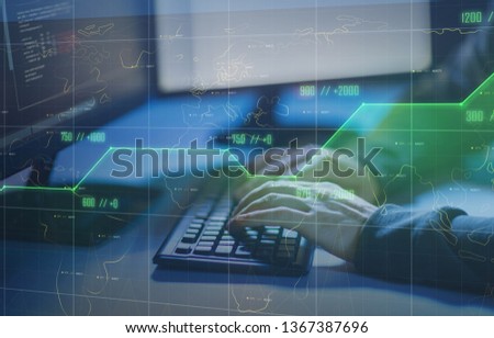cybercrime, hacking and technology concept - hands of hacker in dark room writing code or using computer virus program for cyber attack Royalty-Free Stock Photo #1367387696