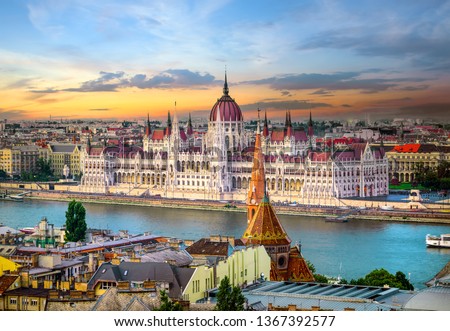 Bright sunset over famous landmarks in Budapest Royalty-Free Stock Photo #1367392577