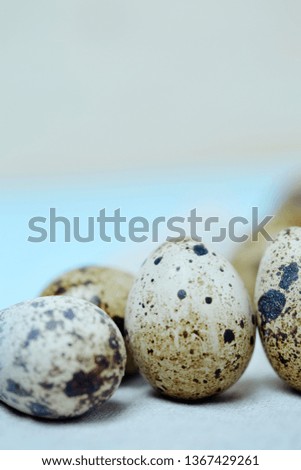 quail eggs on blue old cracked board. holy easter