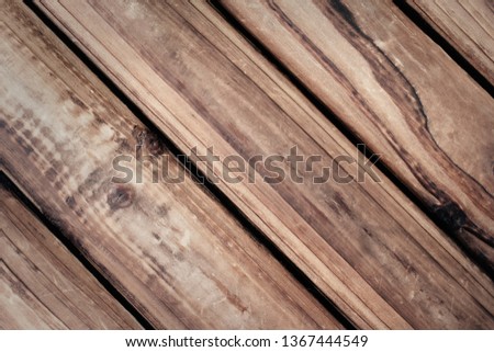 Old dark brown wooden wall, detailed, diagonal. Vintage texture concept for background