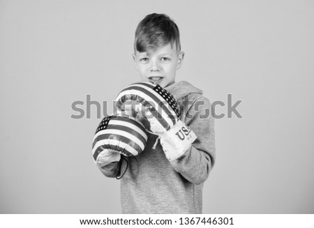 usa independence day. Happy child sportsman in boxing gloves. workout of small boy boxer. punching knockout. Satisfied with his work out. Fitness. energy health. Sport success. sportswear fashion.