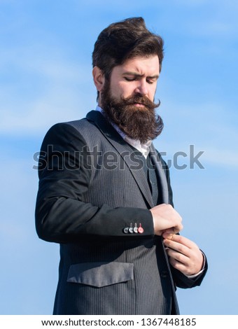 Flawless outfit. Businessman bearded face sky background. Man formal suit adjusting jacket. Male fashion formal menswear. Fashion trend. Guy beard and mustache wear formal clothes. Just right.