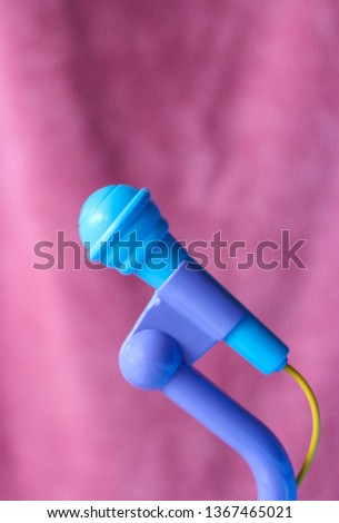 microphone in colorful background. Toy microphone