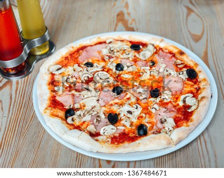 Italian fast food. Delicious hot pizza with ham