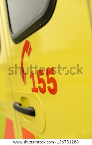 Rescue team's telephone number on yellow ambulance car