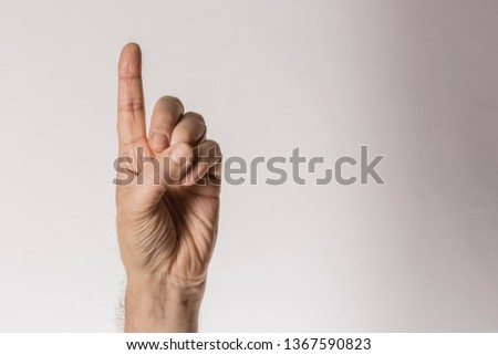 man's hand gesture, counting number one, isolated on white background  - part of set