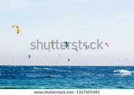 summer vacation and sea activity panorama scenic landscape concept photography with wind surfers people on Mediterranean water surface with empty sky space for copy or text 