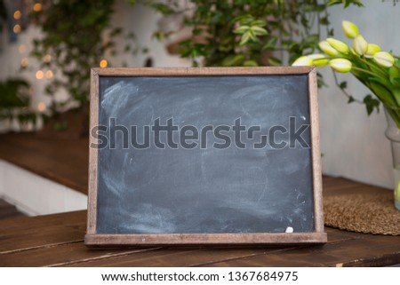 graphite Board for notes on a wooden table, Board for notes, frame on wooden table, copy space