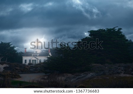 Dramatic picture of Point Pinos lighthouse in Pacific Grove.  Background