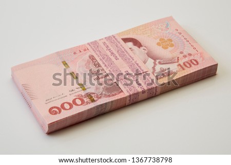 New and latest edition of Thailand one hundred baht banknotes put on on white background. Business and finance concept
