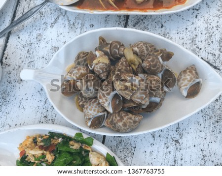close up of boiled shell on white plate