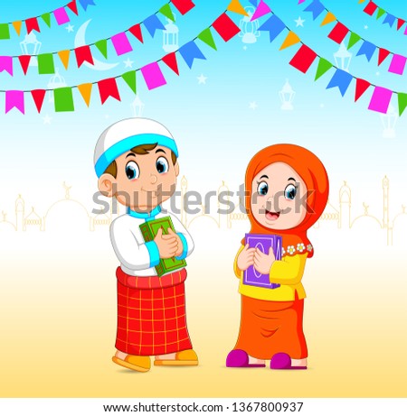 he boy and the girl is holding the al quran in the Ramadan event