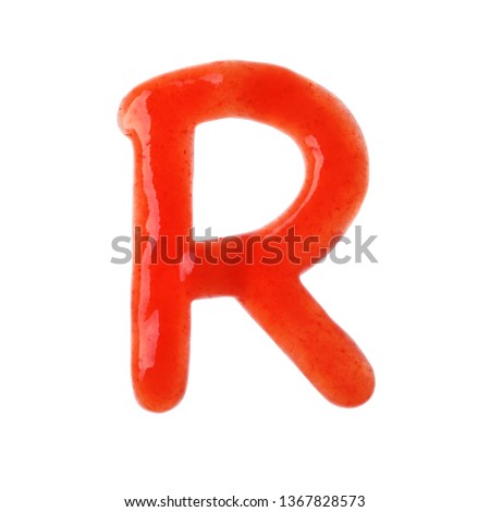 Letter R written with red sauce on white background