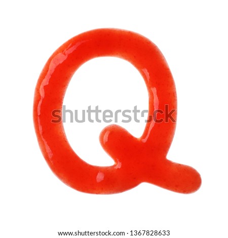 Letter Q written with red sauce on white background