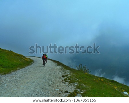 Italian Alps-view of the cyclists  on the cycle path on Monte Baldo