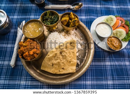 Typical Nepali Dal Bhat Royalty-Free Stock Photo #1367859395