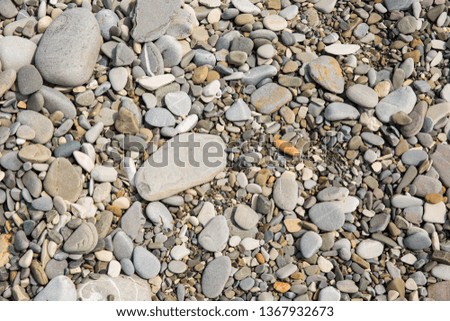 Abstract background with pebbles - round sea stones 