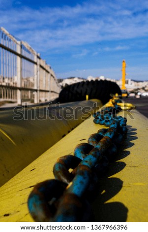 Closeup of iron chain in commercial port