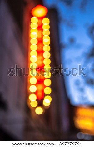 Rows of illuminated globes on a marquee or sign as often used at entrance to theatres and casinos