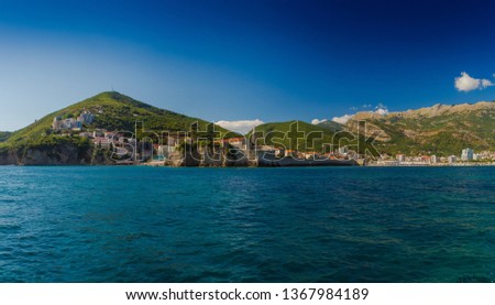 Seascape, view of blue water and mountains and island in Montenegro