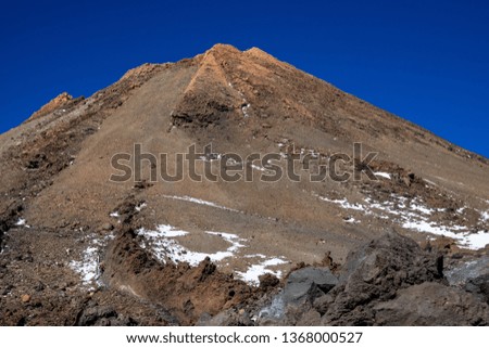 Bottom view of top of Teide volcanic crater in Tenerife with little snow