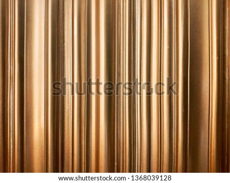 Gold aluminum strips background.