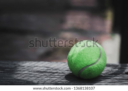 Close up view of tennis racket and balls on the tennis court. Selective focus