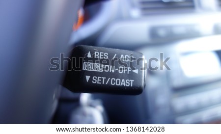 Car details-cruise control switch on the back of the steering wheel with res/acc/cruise/on/off/set/coast commands.  Royalty-Free Stock Photo #1368142028