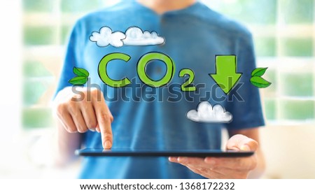 Reduce CO2 with young man using a tablet computer