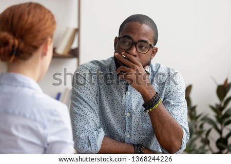 Doubtful unconvinced african american hr manager talking to caucasian applicant at job interview feeling skeptic rejecting seeker skill, bad first impression, lack of experience or failed performance Royalty-Free Stock Photo #1368244226