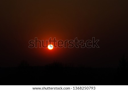 Incredible, beautiful, Bright sunset over the city. Gradient, the core of the sun. Beautiful sunset, red, orange