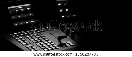 Blurry images of telecine controller machine transferring motion picture film into video and editing or adjusting in a color suite studio lab. which used in the movie post-production process 