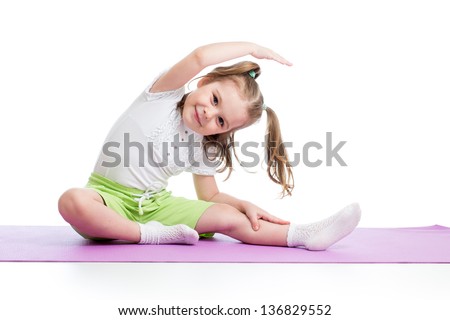 Kid doing fitness exercises Royalty-Free Stock Photo #136829552
