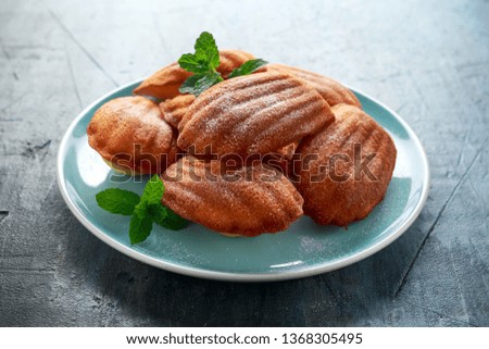 Madeleine French small cake, cookies shell on blue plate