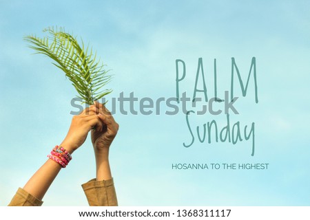 Palm Sunday concept. Young woman hold palm leaves with bright blue sky background. Happy Palm Sunday! Royalty-Free Stock Photo #1368311117