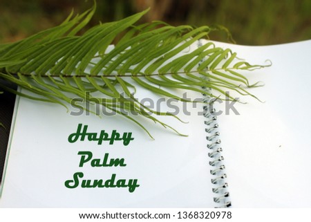Palm leaf with an open book arrangement. Palm Sunday concept. Happy Palm Sunday!