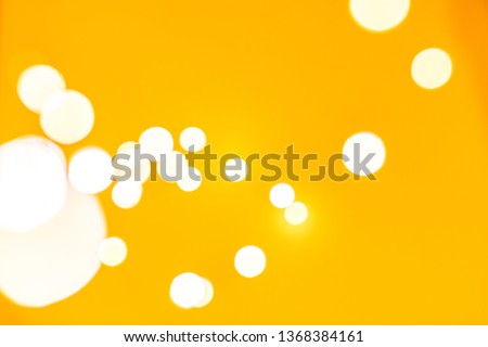 Bokeh of lights on yellow background 