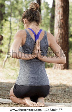 lim tourist woman sitting with arms doing yoga