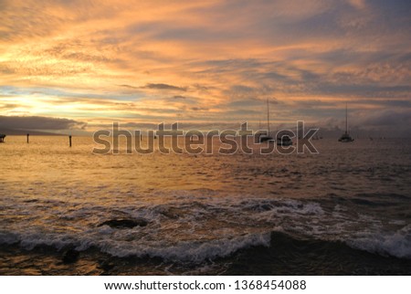 Golden Cloudy Sunset on Lahina Hawaii sandy beach