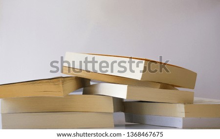 Heap of books isolated on white background. Lots of university school books texture pattern. Stack of novels.