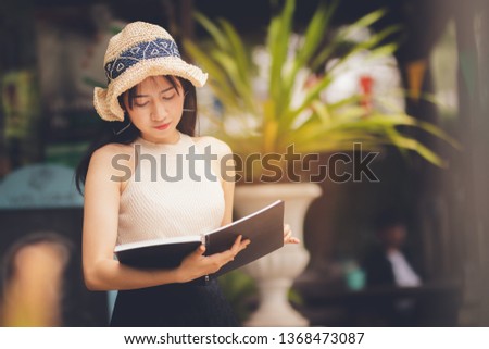 Asia woman ,teen girl reading book in free time with happy .