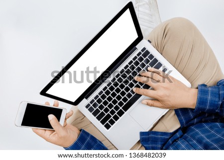 Young businessman working at laptop computer with smartphone , Business Research, business man hand working on laptop computer, business concept, selective focus,Laptop background
