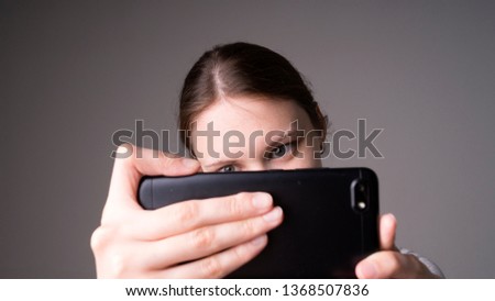 Smiling young woman making selfie photo