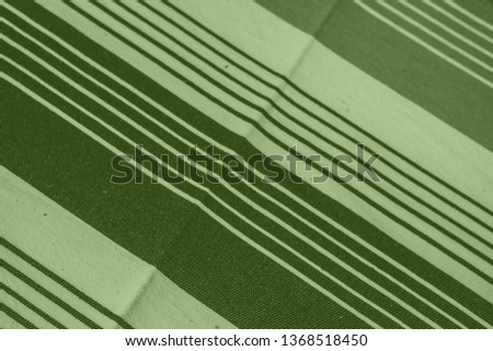 Striped pattern with stylish colors. Green and white stripes. Greenery background for design in a vertical strip