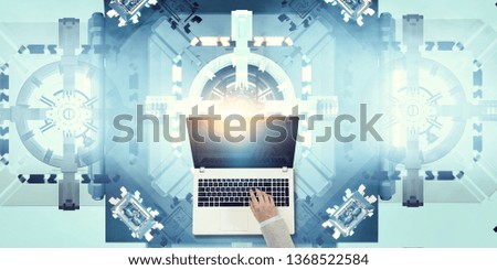 Businesswoman hand on laptop on tech background. Mixed media