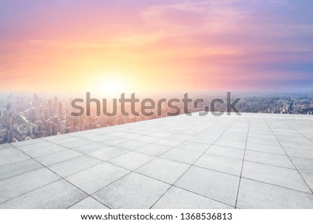 Shanghai city skyline and empty square floor with beautiful clouds scenery at sunset