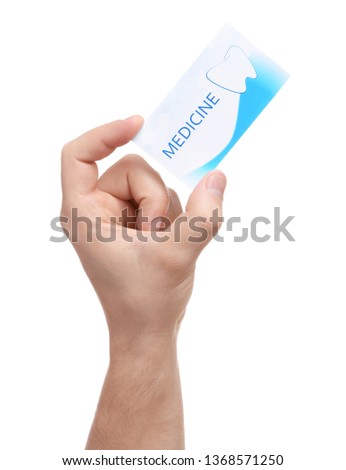 Man holding business card isolated on white, closeup. Dental medical service